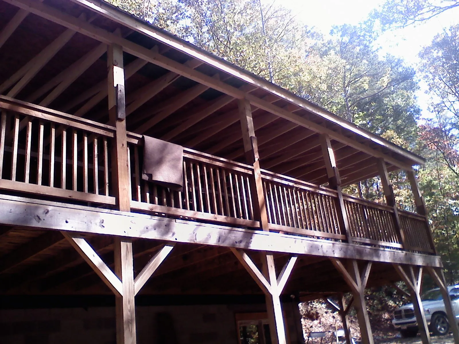Timber framing under a new elevated porch and deck — Roof Leak Repair in Manitou Beach by Roofing Brothers